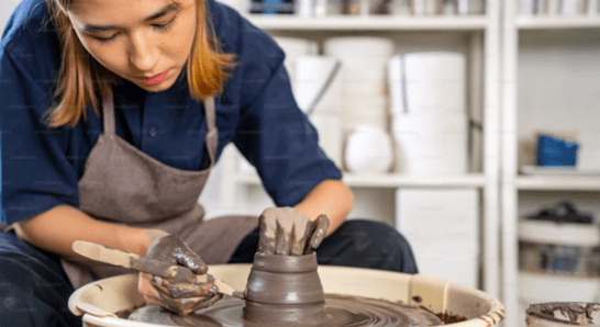 Apprentice Creating A Clay Pot